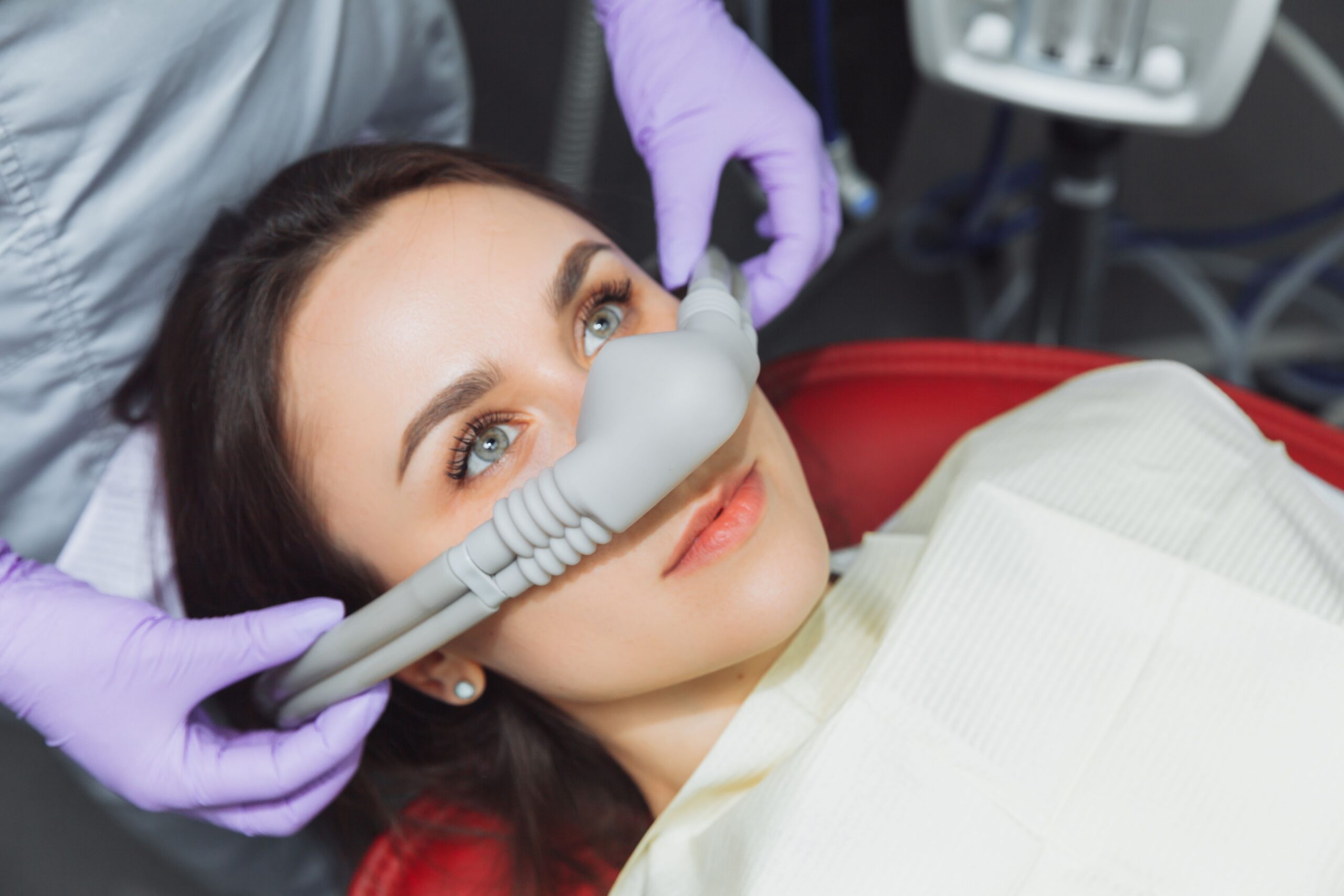 Dental patient receiving nitrous oxide through a nasal mask