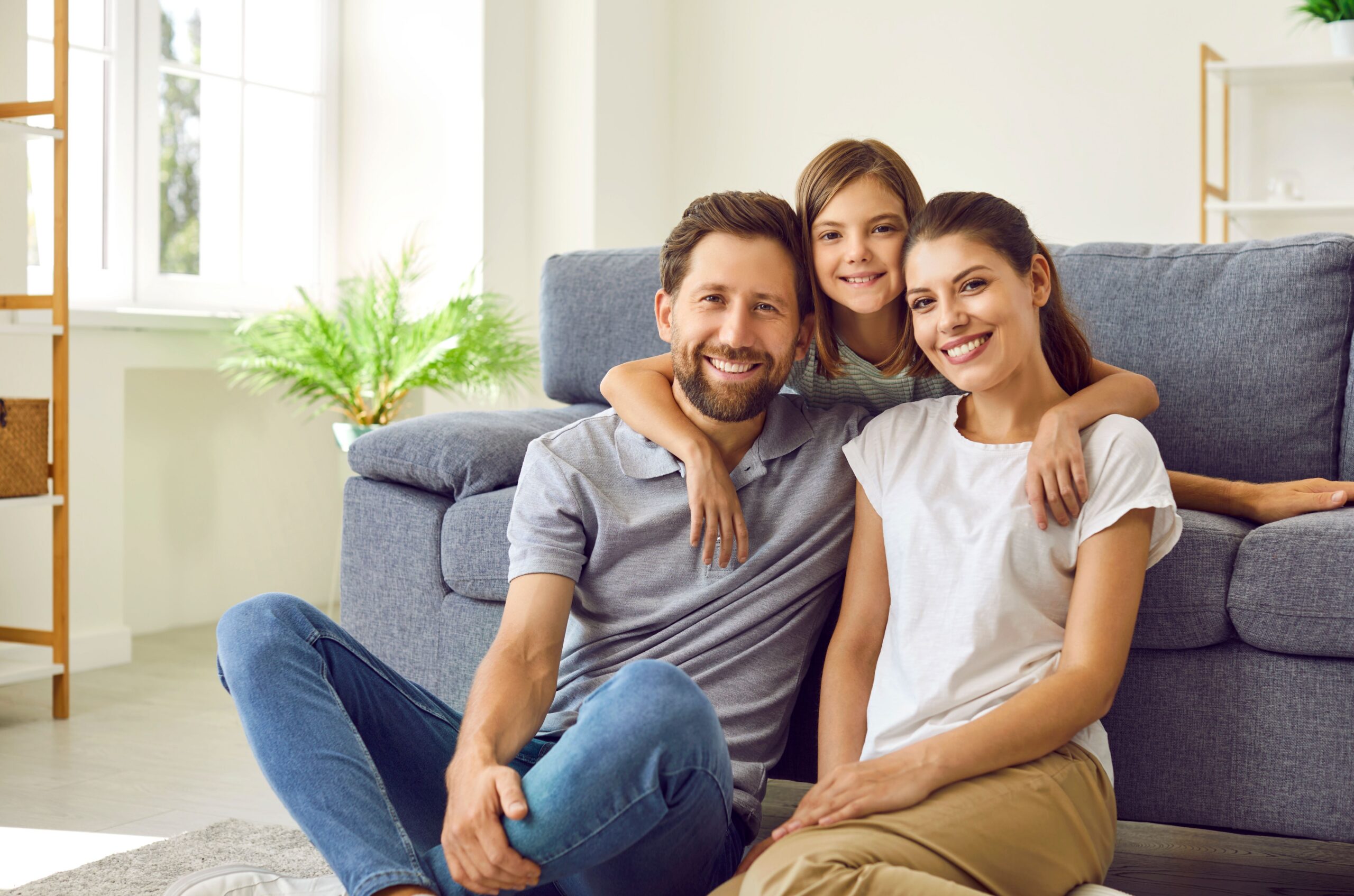 Happy family smiling together at home