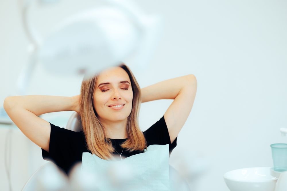 Relaxed patient resting in a dental chair after treatment